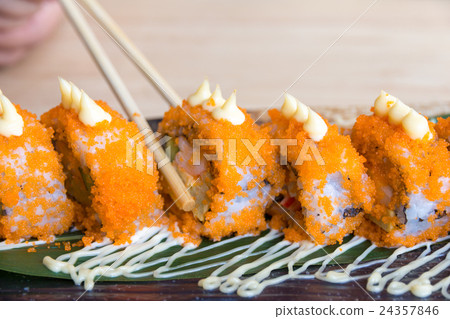 Sushi California rolls with chopsticks Sushi California rolls with chopsticks 24357846