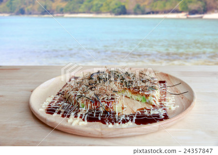 Japanese pizza on plate - Okonomiyaki Japanese pizza on plate - Okonomiyaki 24357847