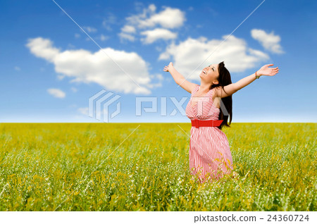 young women in a field young women in a field 24360724