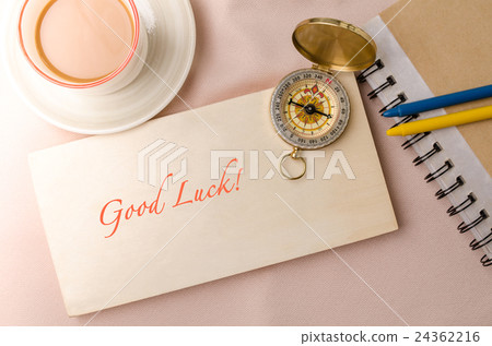 Good luck message and vintage compass on wooden Good luck message and vintage compass on wooden 24362216