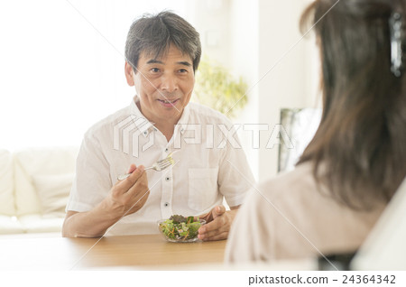 A man eating a salad A man eating a salad 24364342
