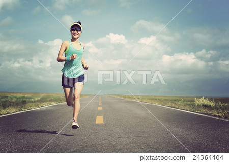 young fitness woman runner running on road young fitness woman runner running on road 24364404