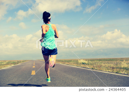 young fitness woman runner running on road young fitness woman runner running on road 24364405
