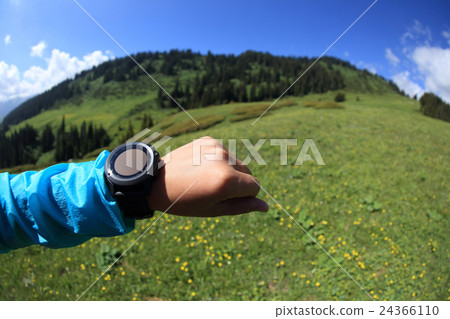 checking the altimeter on sports watch   24366110