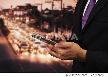 Business man using mobile Phone night light road Business man using mobile Phone night light road 24369285