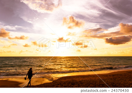 silhouette woman walking on the beach silhouette woman walking on the beach 24370430