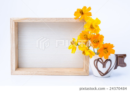 Photo frame with books and flowers on wooden table Photo frame with books and flowers on wooden table 24370484