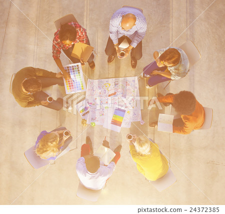 Design Team Planning on a Project with Color Swatches 24372385