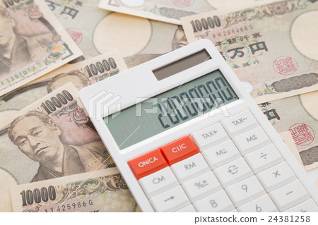 Calculator and 10,000 yen financial image 24381258