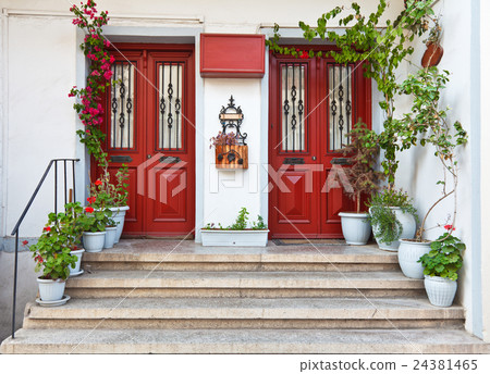 Beautiful twin red door with flower Beautiful twin red door with flower 24381465