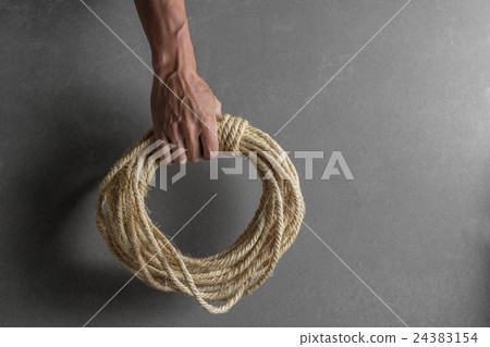 Hand holding ship rope Hand holding ship rope 24383154