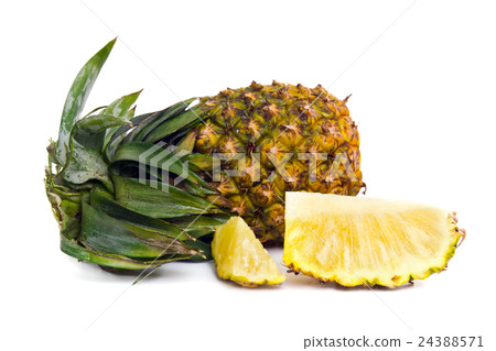 Fresh pineapple with slices isolated on white 24388571