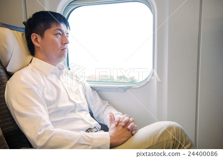 Men relaxing in the train of the bullet train 24400086