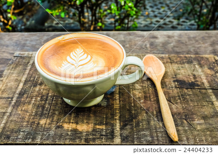 Latte Art Coffee Mug on Wooden Table Latte Art Coffee Mug on Wooden Table 24404233