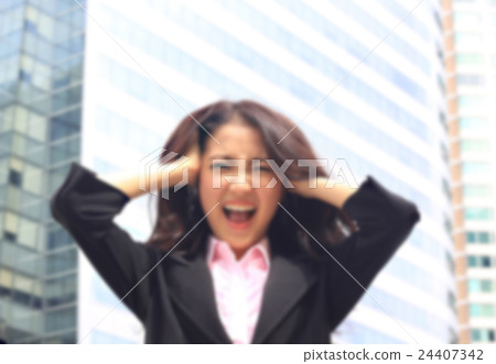 Asian woman in business suite with angry face Asian woman in business suite with angry face 24407342