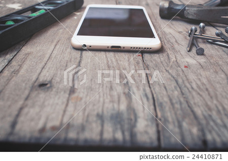 Hammer and nails meter level with smart phone Hammer and nails meter level with smart phone 24410871