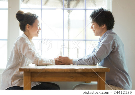 A couple holding hands 24412189