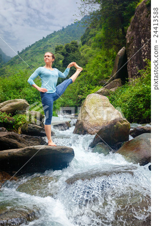 Woman doing Ashtanga Vinyasa Yoga asana outdoors 24413588