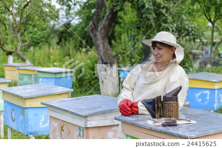 Portrait of a woman beekeeper 24415625