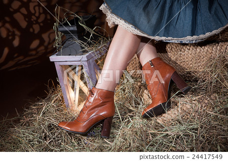 Woman's Legs, Lantern And Hay 24417549