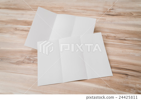 Trifold white template paper on wood texture . 24425811