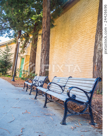 Wood Bench against concrete wall . 24426696