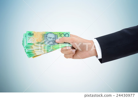Businessman hand giving money, Australian dollars Businessman hand giving money, Australian dollars 24430977