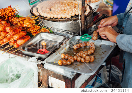 Thai woman cooks meatballs 24431154