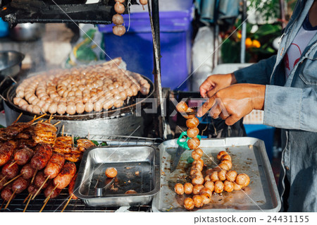 Thai woman cooks meatballs 24431155