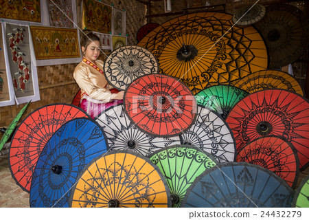 Asian Women in Umbrella Shop in Bagan in Myanmar Asian Women in Umbrella Shop in Bagan in Myanmar 24432279