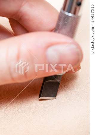 blade of swivel knife cut leather close up 24437519