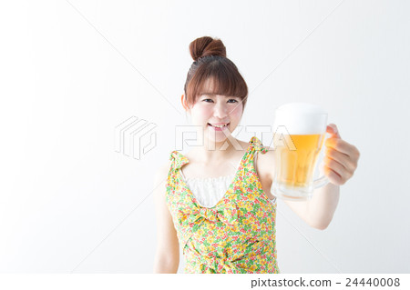 Woman drinking beer · white wall 24440008
