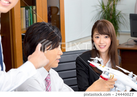 Male employee female employee drone introduction review company unmanned aerial vehicle radio control pilot aircraft quad copter 24440027