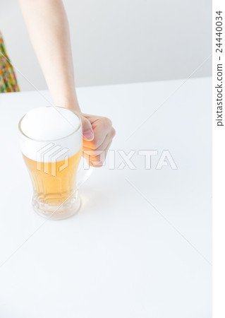 Woman drinking beer 24440034