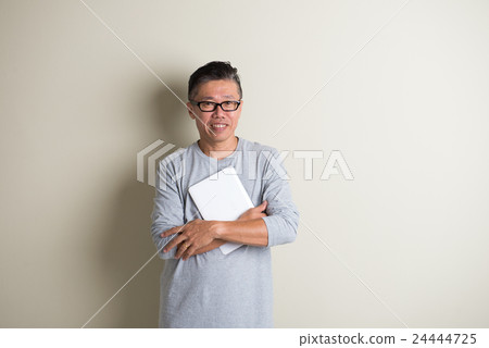 matured asian male using tablet matured asian male using tablet 24444725