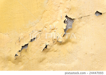 yellow erode painted concrete wall 24447093