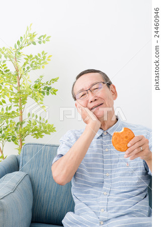 Senior men eating crackers Senior men eating crackers 24460946