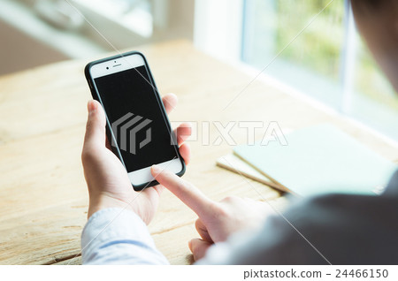 Hand to operate a smartphone (Male in twenties) Hand to operate a smartphone (Male in twenties) 24466150