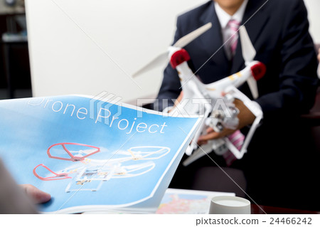 Male employee female employee drone introduction review company unmanned aerial vehicle radio control pilot aircraft quad copter 24466242