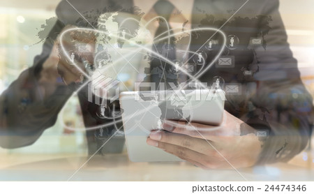 Businessman using the tablet and holding cup of coffee over the Worldwide connection technology interface, Elements of this image furnished by NASA, Business technology concept Businessman using the tablet and holding cup of coffee over the Worldwide connection technology interface, Elements of this image furnished by NASA, Business technology concept 24474346