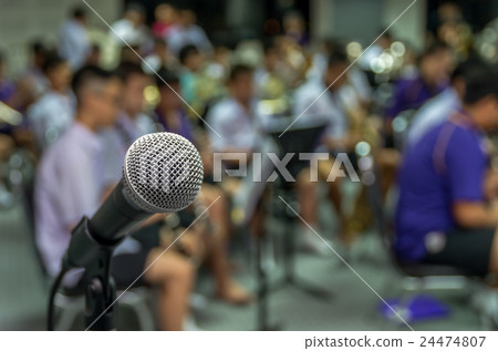 Microphone over the Abstract blurred photo of classic music band when rehearsal, musical concep, seminar meeting concept 24474807