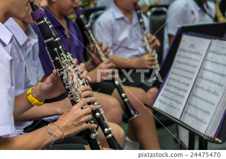 Close up of Clarinetist performance which is some part of classic music band when rehearsal, musical concept Close up of Clarinetist performance which is some part of classic music band when rehearsal, musical concept 24475470