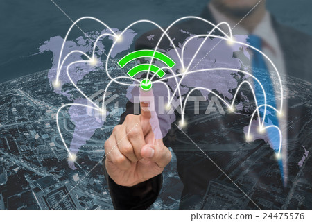 Businessman pointing or touching the wifi icon symbol on over the top view of cityscape background and world map background which dicut each elements, business network connection concept Businessman pointing or touching the wifi icon symbol on over the top view of cityscape background and world map background which dicut each elements, business network connection concept 24475576