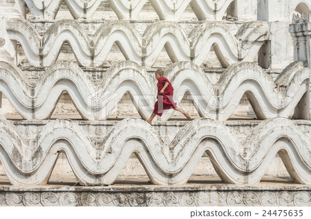 The young monk are running and jumping on the Mya Thein Tan Pagoda at bagan, mandalay, myanmar 24475635