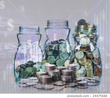 Double exposure of stack of coins and mix coins in clear bottle on blurred photo of cityscape and financial graph with cityscape background, Business Trading and investing concept Double exposure of stack of coins and mix coins in clear bottle on blurred photo of cityscape and financial graph with cityscape background, Business Trading and investing concept 24475686