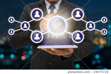 Businessman holding the tablet with the Social media symbol on Blurred Photo bokeh of cityscape, Elements of this image furnished by NASA, Business network concept Businessman holding the tablet with the Social media symbol on Blurred Photo bokeh of cityscape, Elements of this image furnished by NASA, Business network concept 24475728