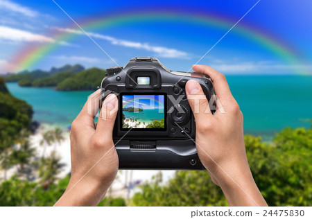 Hands holding the camera which taking photo of Top view of Ang Thong National Marine Park with rainbow, Thailand 24475830