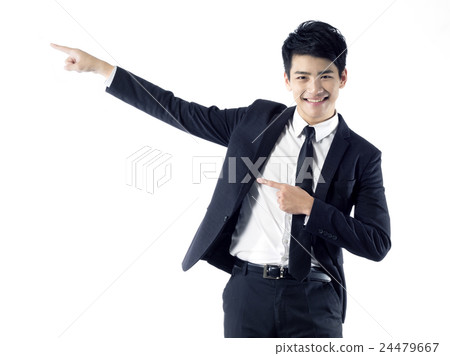 Businessman points sky Businessman points sky 24479667