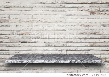 Empty top of natural stone shelves and stone wall background 24491405