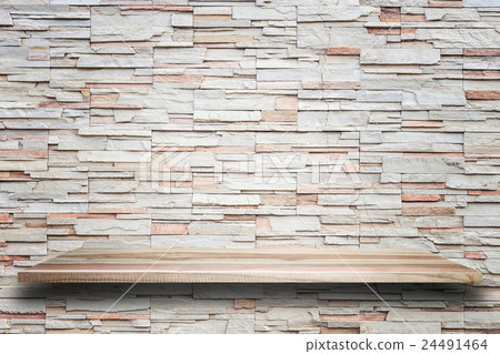 Empty top wooden shelves and stone wall background 24491464